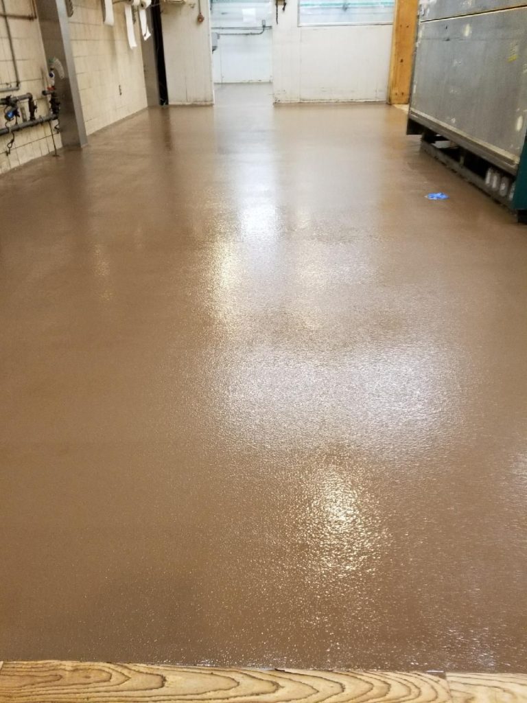 Solid tan color urethane flooring at Idylwild Farms in Acton, MA, designed for durability, slip resistance and food safety.