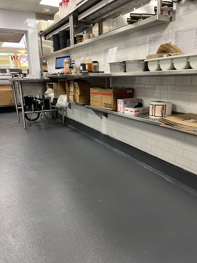 A small commercial kitchen has FDA-compliant floors for a clean and safe environment.