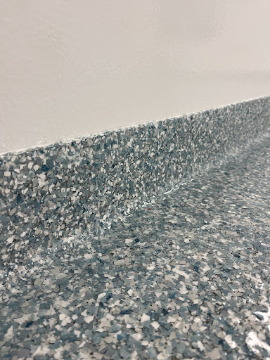 A hygienic seamless flooring system has cove base transitions between floors and walls for contamination control.