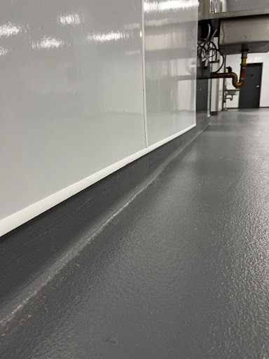 Hygienic cove base flooring is used to meet safety and sanitation standards.