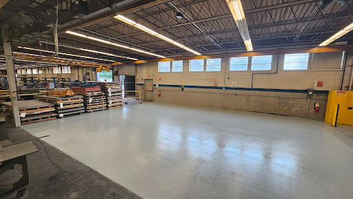 Industrial flooring inside a warehouse facility is engineered for safety, simple maintenance and long-term durability.